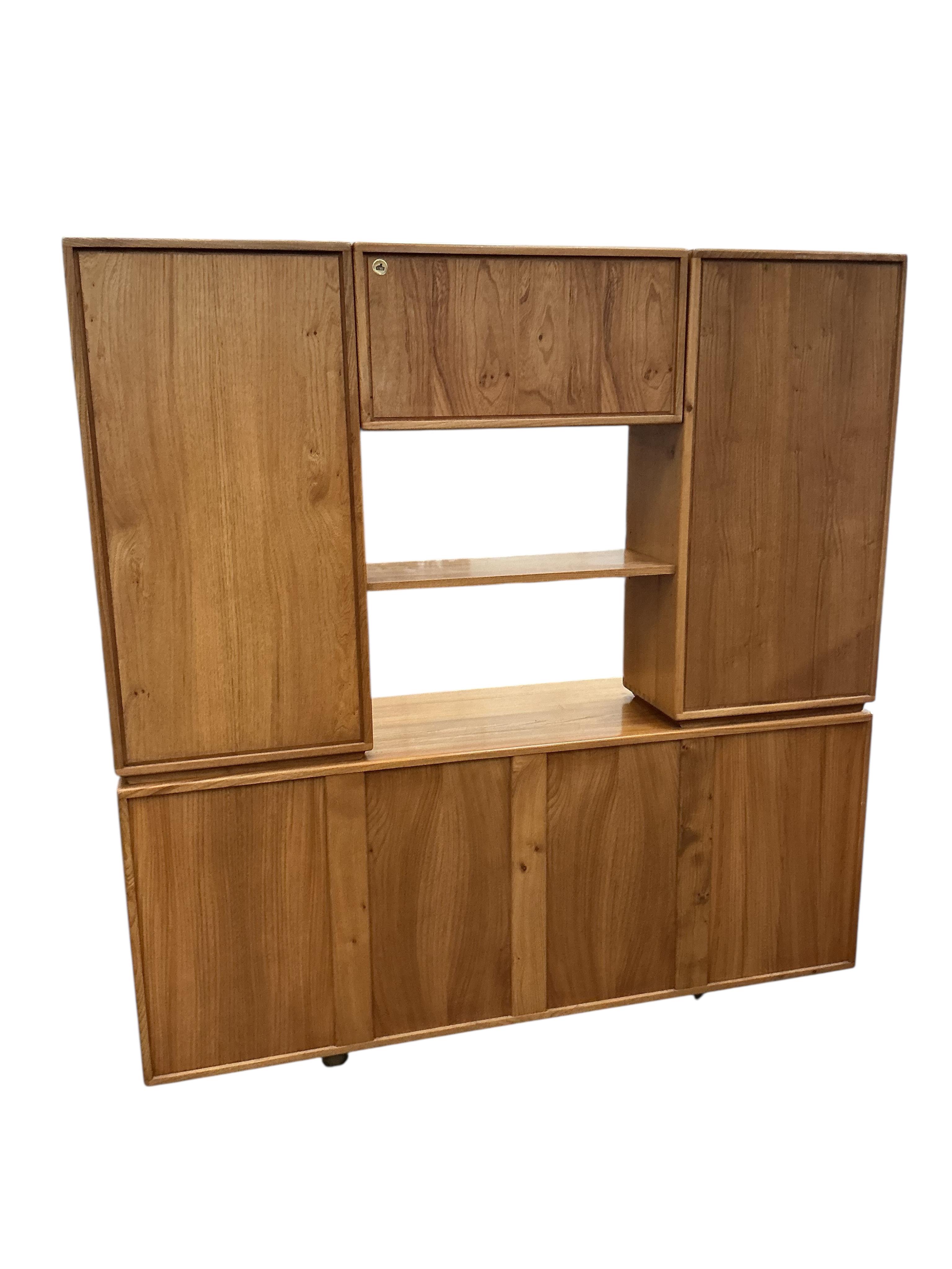 An Ercol Windsor light elm sideboard, width 155cm, depth 44cm, height 162cm